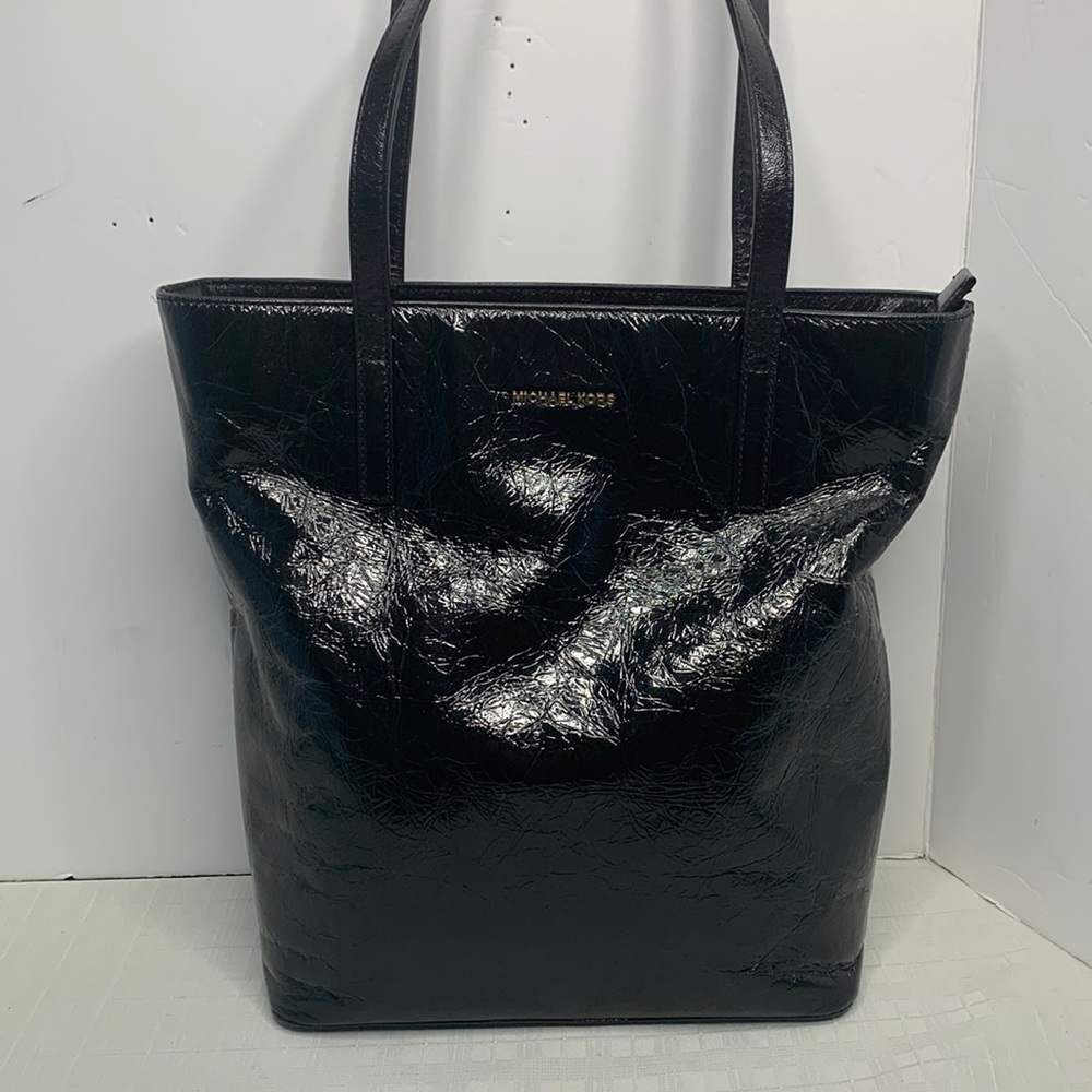 Michael Kors a black Vertical Tote.